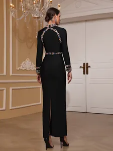 Elegant black bandage evening gown with ornate crystal beadwork and back slit detail