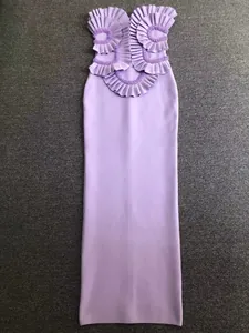 Detailed view of elegant purple strapless bandage dress with intricate ruffles and beading