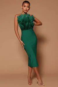 Elegant emerald green strapless midi bandage dress with lush feather bustier detail.