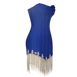 Detailed view of blue bandage dress with crystal embellishments and metal chain fringe