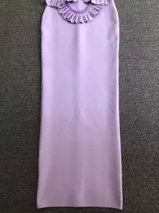 Detail view of a stylish purple bandage maxi dress featuring a ruffled beaded neckline