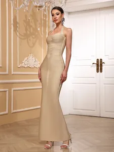 Close-up of elegant champagne sleeveless halter bandage maxi dress for formal banquet