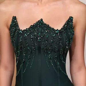 Emerald green strapless bandage evening dress featuring intricate rhinestone and bead embellishments
