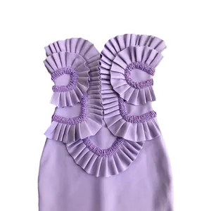 Elegant purple strapless bandage dress featuring stylish ruffles and intricate beadwork details