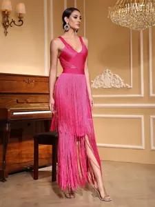 Detailed view of a hot pink fringe bandage dress with deep V-neckline and elegant tassels