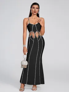 Elegant black bandage maxi dress with sexy waist cut-outs and rhinestone vertical stripes.