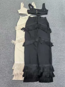 Close-up detail of layered fringe design and waist cutouts on sexy knit bandage dresses