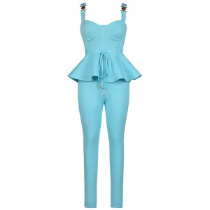 Light blue two-piece rib-knit set with peplum top and pants featuring metal buckles.
