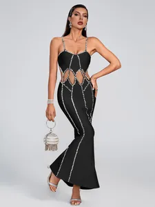 Stunning black bandage evening dress with vertical rhinestone patterns and waist cutouts.