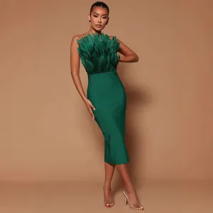 Elegant emerald green strapless midi bandage dress with luxurious feather bust detailing
