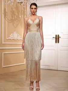 Elegant detail of a champagne gold fringe bandage dress for luxury gala and red carpet