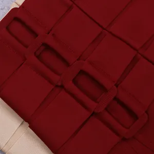 Macro detail view of wine red bandage dress featuring fabric-covered decorative buckles.