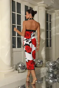 Back view of red rose print halter bandage midi dress for party wear