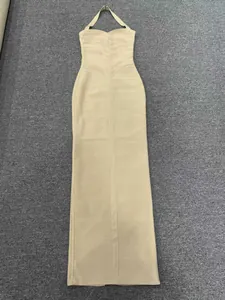 Full view of elegant beige halter neck bandage maxi dress with slim fit design