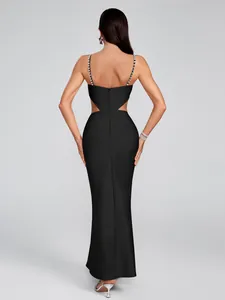 Elegant black bandage maxi dress with rhinestone straps and waist cut-outs back view