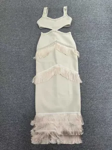 Elegant beige knit bandage dress featuring tiered fringe details and a waist cut-out.