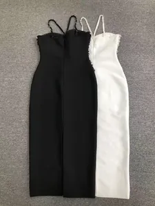 Back view of elegant black and white beaded bandage midi dresses with spaghetti straps.