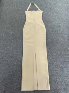Detailed view of beige halter bandage maxi dress with elegant back slit design for formal.