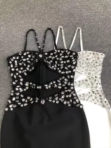 Close-up of elegant black and white rhinestone cutout bandage cocktail dresses