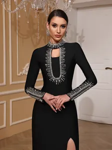 Detail view of a black bandage evening dress with ornate silver rhinestone embellishments