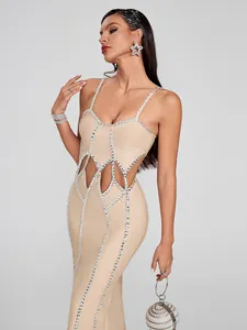 Full length detail of a nude bandage dress featuring v-neck and rhinestone cut-outs.