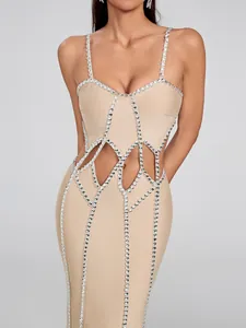 Detail view of beige bandage dress with rhinestone trim and waist cutouts design