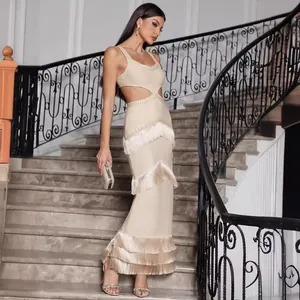 Elegant beige knit bandage maxi dress featuring cutout waist and layered fringe tassels