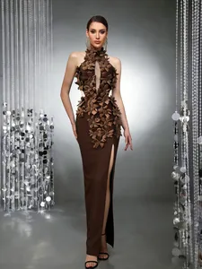 Detail view of a coffee brown evening gown with 3D floral embellishments and high slit