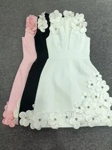 Close-up of 3D floral appliqués with rhinestones on heavy bandage evening dress.
