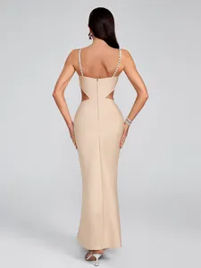 Detailed back view of a sexy beige bandage gown featuring rhinestone straps and waist cutouts.