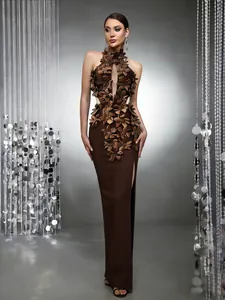 Detailed view of the 3D floral ornaments and high-slit design on this coffee gown