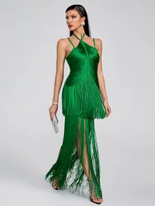 Detailed view of the vibrant green fringe halter-neck evening dress on a fashion model.