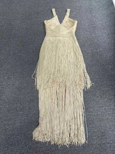 Detailed flat lay of champagne fringe bandage dress with deep V-neckline and slim fit