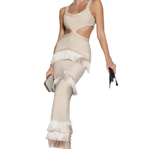 Elegant beige knit bandage maxi dress with cut-out waist and tiered tassel fringe