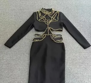 Elegante vestido de vendaje negro con detalles de cuentas huecas y manga larga de fiesta