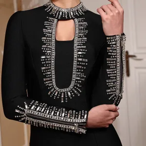 Elegant black long-sleeved bandage dress with heavy crystal beadwork for formal evening parties.