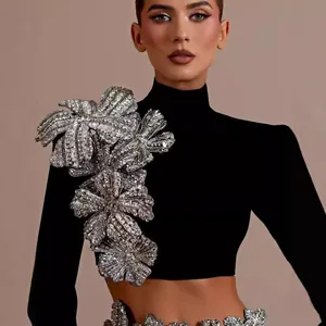 Luxury black bandage set featuring sequin floral appliqués on long sleeve mock neck top