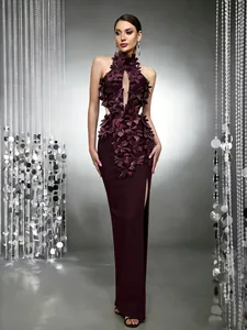 Elegant burgundy evening gown featuring intricate 3D floral appliqués and a sexy high leg slit