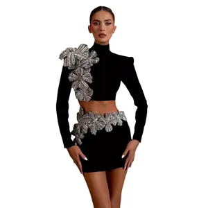 Black bandage two-piece set with long sleeve crop top and silver floral diamond mini skirt