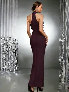 Back view of elegant burgundy floor-length evening gown with halter neck and ruffles