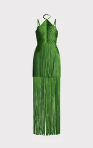 Detailed view of the vibrant green fringe and tassel textures on halter maxi dress