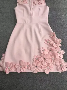 Detail of pink bandage dress with exquisite 3D floral and rhinestone decorations