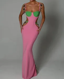 Elegant pink and green hollow-out bandage dress with heart-shaped metal jewelry details.