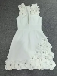 Detailed view of exquisite 3D floral appliqués and crystal beads on white bandage dress