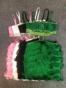 Detail of colorful two-piece bandage sets featuring rhinestone tops and fringe mini skirts