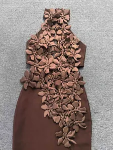 Detail of coffee brown bandage dress featuring intricate 3D floral applique decorations.