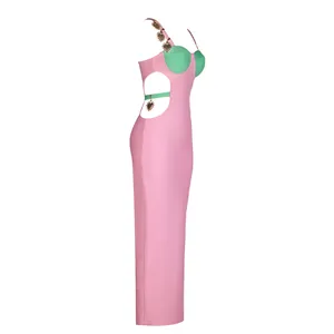 Side view detail of pink bandage maxi dress featuring cutouts and heart metal charms