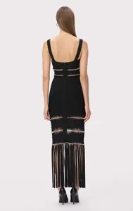 Rear detail of a black bandage evening dress with shimmering sequins and long fringe hem