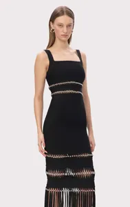 Detailed view of black bandage dress with silver sequins and tassel fringe hem