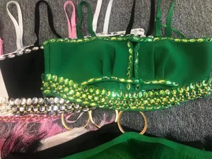 Close-up of sexy bandage tops with sparkling rhinestones and hollow metal ring details